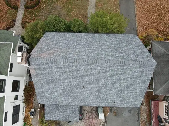 Finished gray architectural shingle roof seen from above