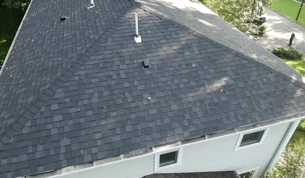A continuous ridge vent installed to balance attic airflow and keep the roof deck cold, the permanent fix that stops ice dams from forming